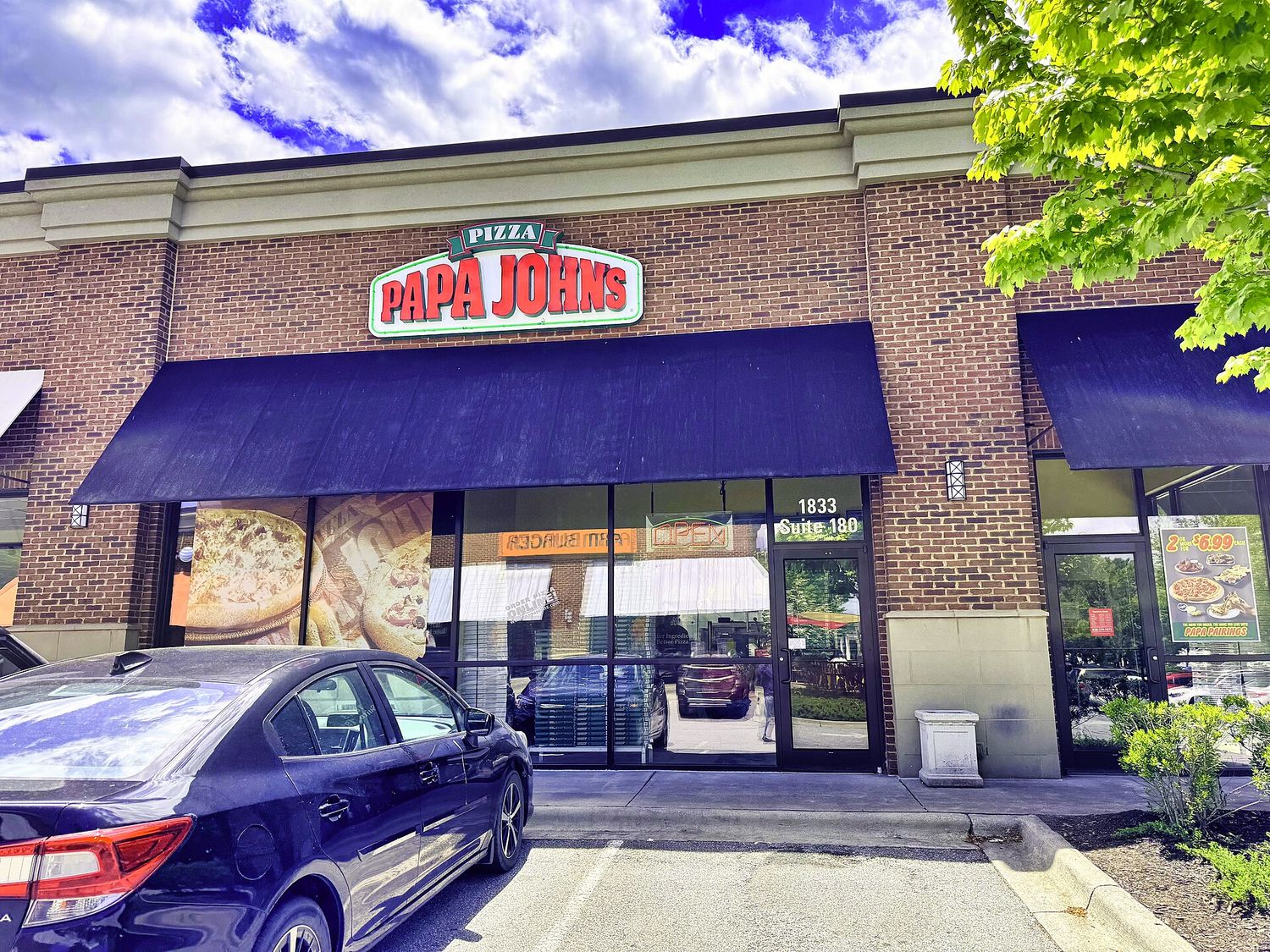 Papa Johns Pizza Restaurant Storefront in Asheville, North Carolina