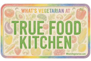 Colorful sign that reads 'TRUE FOOD KITCHEN' with 'WHAT'S VEGETARIAN AT' at the top and a vegetable border around the edge.