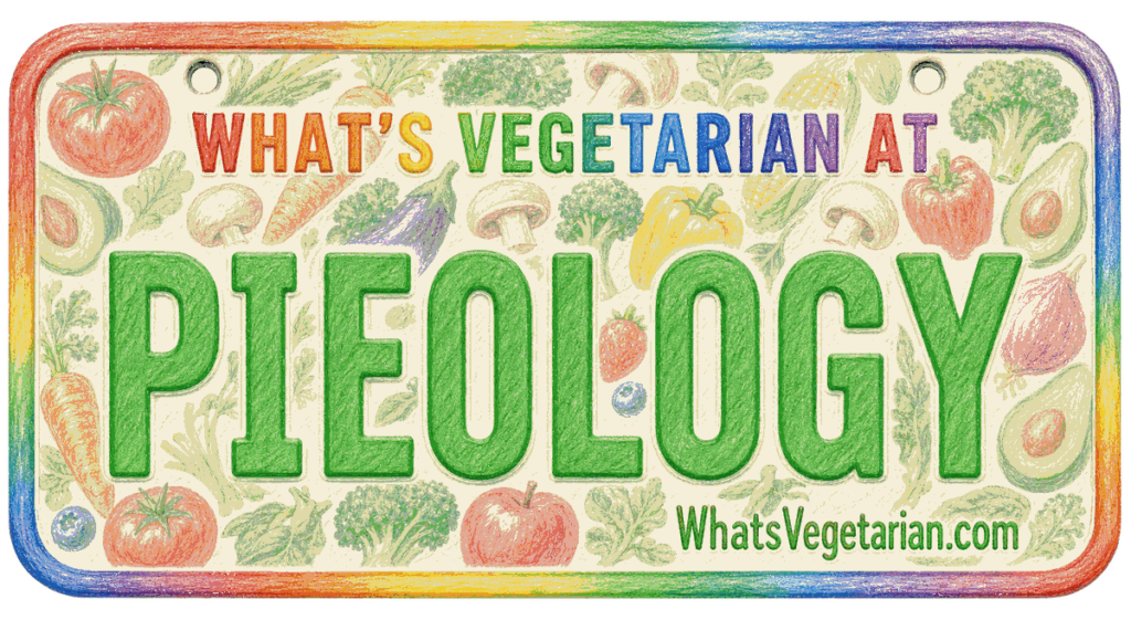 Colorful rectangular sign with a rainbow border reading 'WHAT'S VEGETARIAN AT' and a large word 'PIEOLOGY' surrounded by vegetables; includes 'WhatsVegetarian.com'