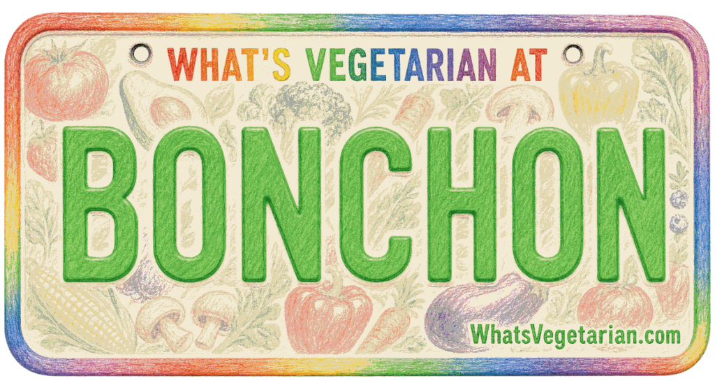 Promotional sign for Bonchon featuring 'What's Vegetarian At' and large green BONCHON lettering with a colorful rainbow border.