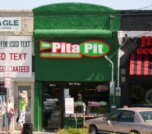 Pita Pit restaurant storefront, where Pita Pit vegetarian options include falafel and hummus pitas