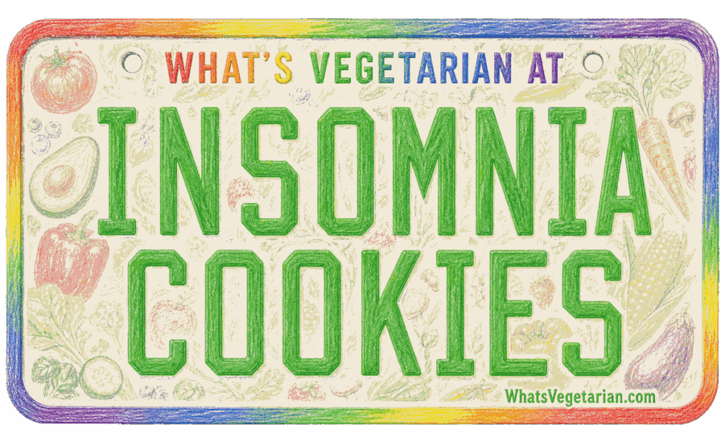 Colorful sign reading 'INSOMNIA COOKIES' with rainbow border and 'WHAT'S VEGETARIAN AT' above it.