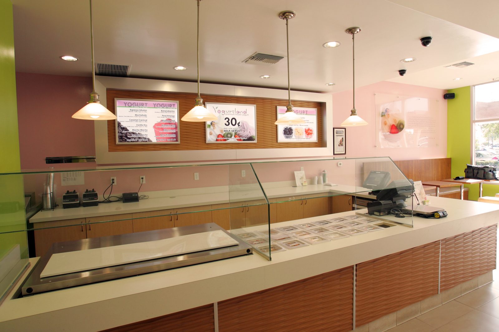 Yogurtland self-serve frozen yogurt bar with flavor machines and cups
