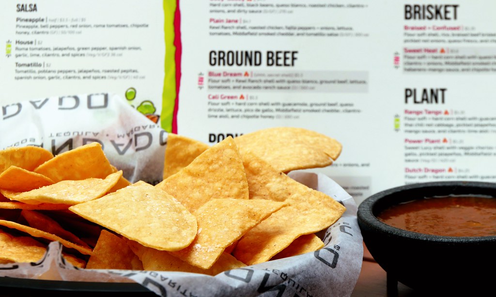Condado Tacos vegetarian options: tortilla chips and salsa, a vegan side